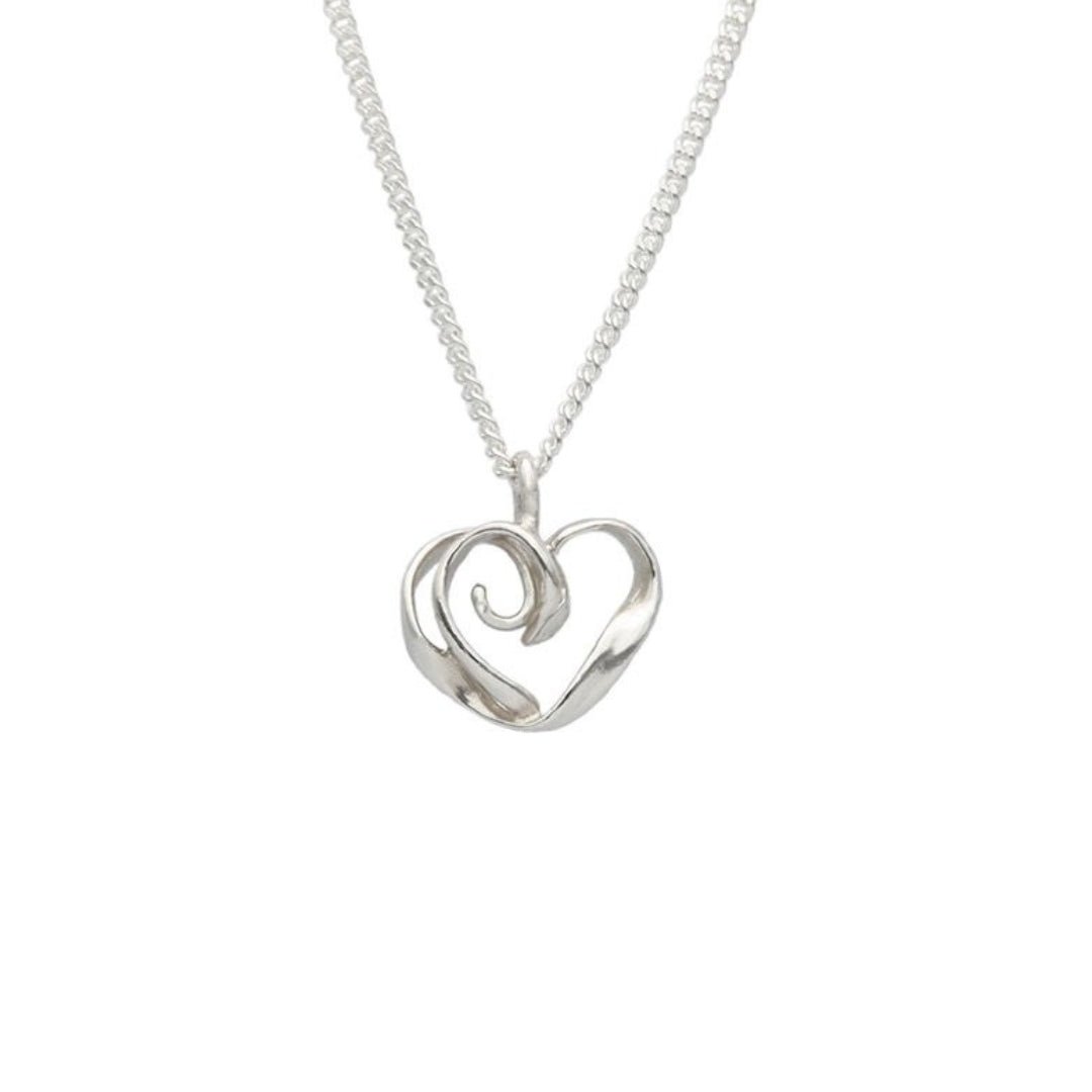 Heart shaped pendant in sterling silver on a matching chain against a white background
