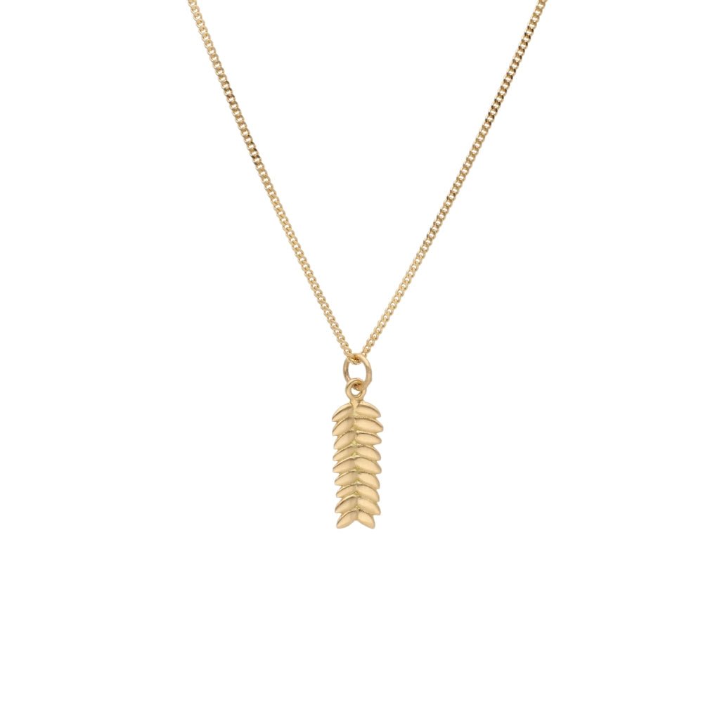 RÅG XS 18K gold necklace with a vertical leaf pendant hanging from a delicate chain