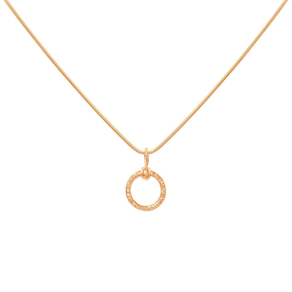 18K gold CIRCLA necklace with a textured circular pendant on a delicate chain