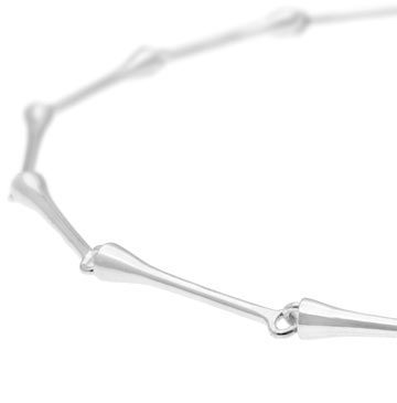 Peggy collier necklace in sterling silver with a round nickel-free beaded cluster pendant on a model's neck