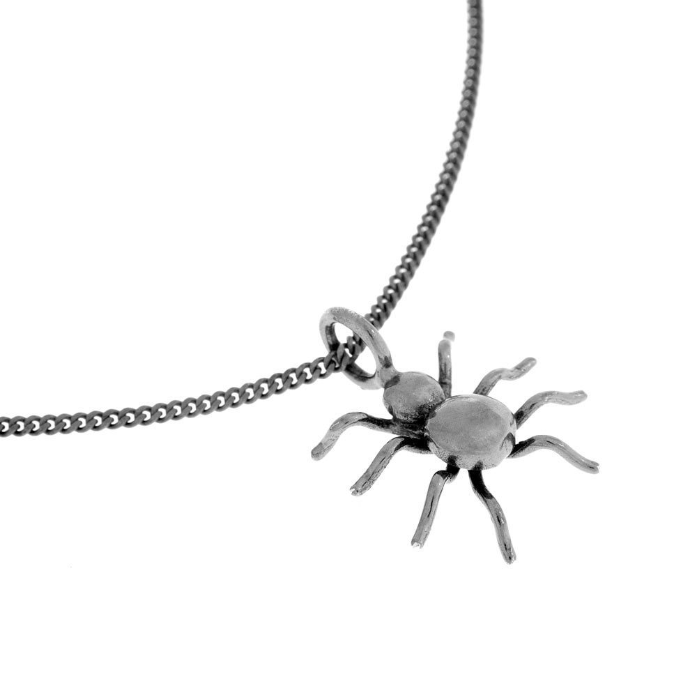 SPINDEL L necklace in antique silver with a small spider pendant on a chain.