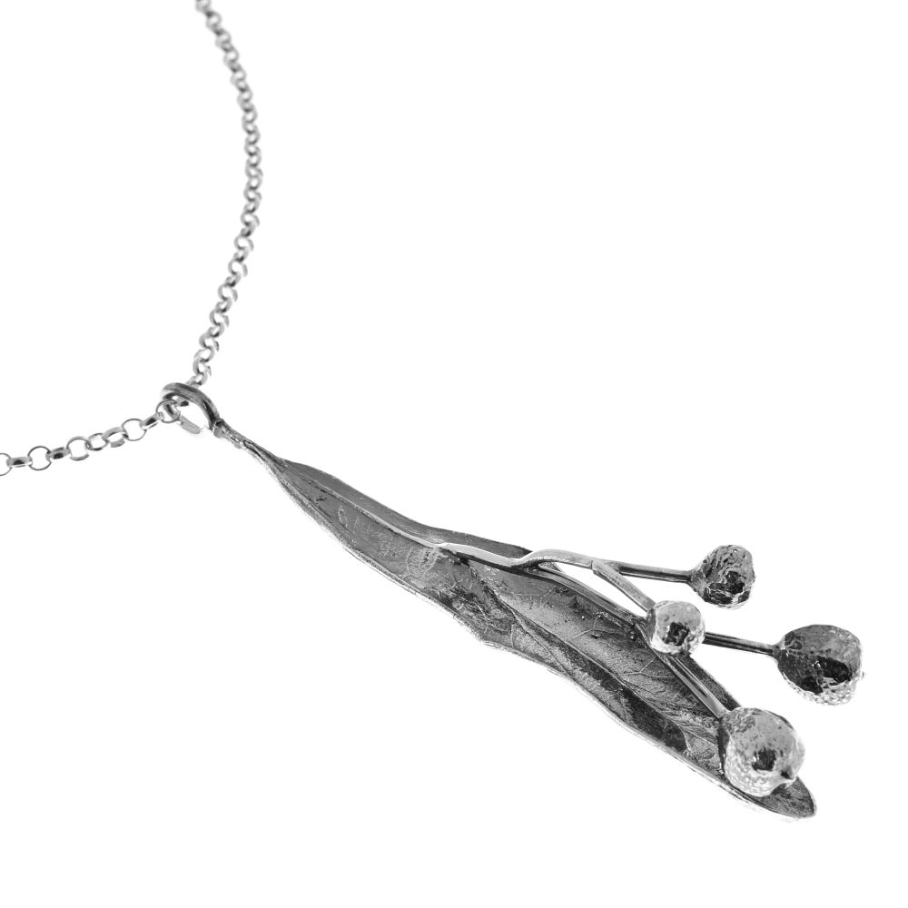 TILIA FRÖ necklace pendant in silver featuring a slender leaf and round seed pods