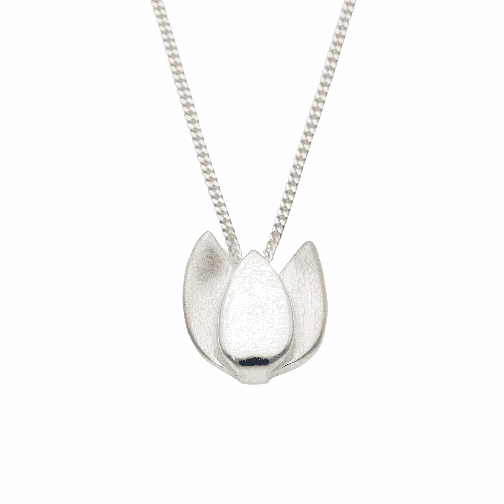 Close up of a silver Tulpan Nova tulip pendant on a delicate chain.