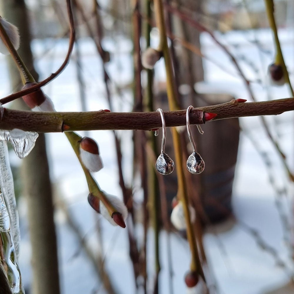 Close up of TILIA Frö earring in 925 sterling silver worn on the ear