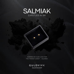 Two square 18K gold stud earrings presented in a black box on a dark background.