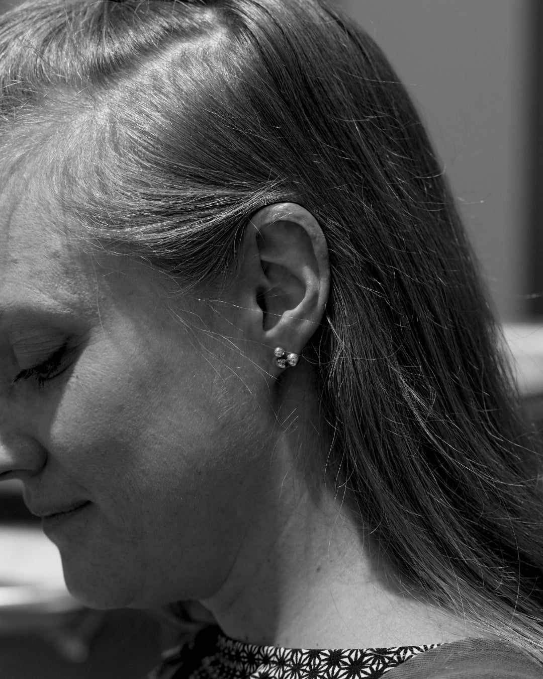Woman wearing HAVTORN 925 sterling silver cluster ball stud earrings