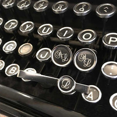 ALFA cufflink with round monogram faces on dark center, crafted in 925 sterling silver with antique finish.