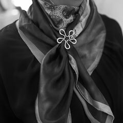 BLOMMAN L Scarfring in 925 sterling silver securing a scarf with a flower shaped clasp