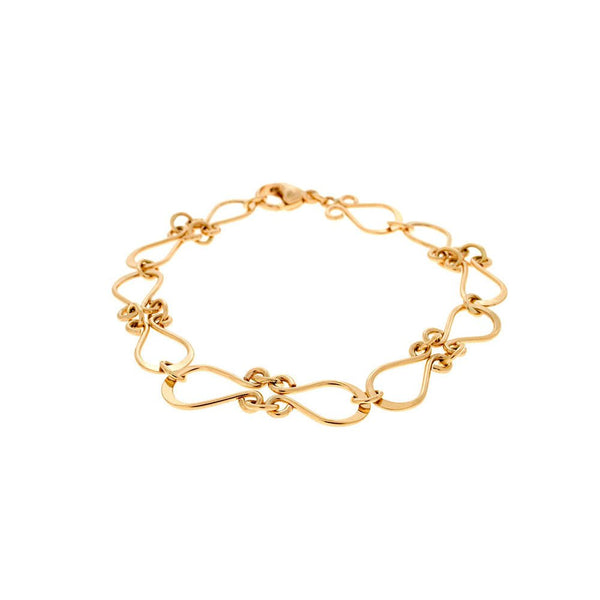 18K guld armband med mjukt böjda länkar inspirerat av traditionell ornamentik