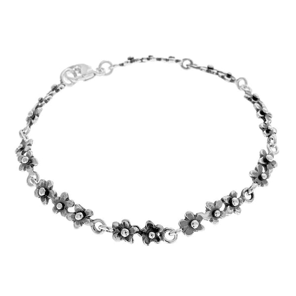 FÖRGÄT MIG EJ armband i sterling silver med små blomformade länkar längs kedjan