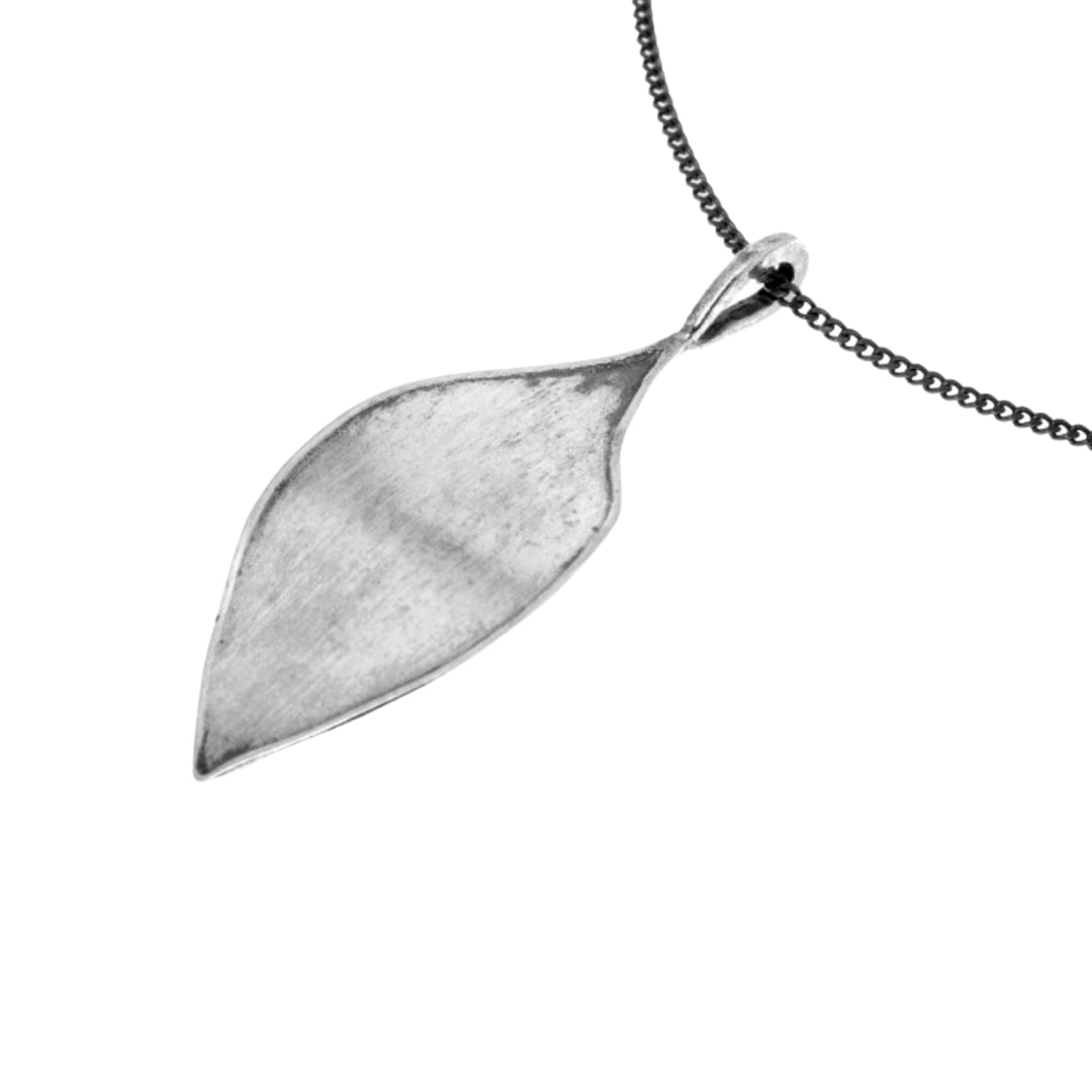 Antique silver leaf pendant on a matching antique curb chain