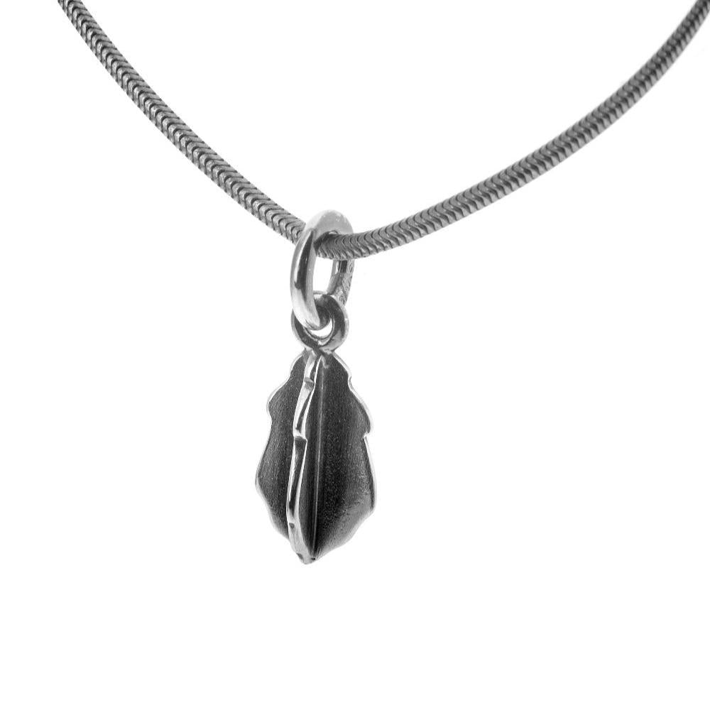 Silver necklace with a small leaf shaped pendant on a textured snake chain