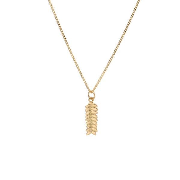 RÅG XS 18K gold necklace with a vertical leaf pendant hanging from a delicate chain