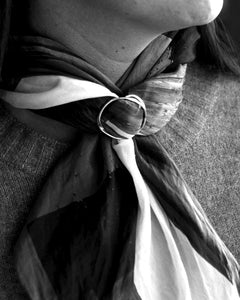 Maja S Scarfring in sterling silver worn around a scarf knot