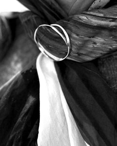 Maja S Scarfring in sterling silver featuring two interlocking rings resting on scarf