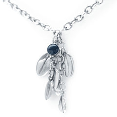 Silver necklace with a blue cabochon bead and multiple dangling leaf charms