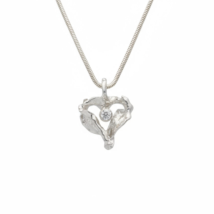 Silver heart shaped pendant with a central cubic zirconia gem