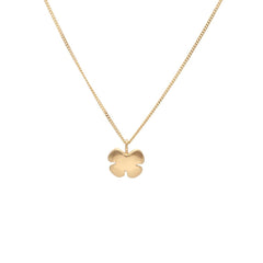 Close up of KLÖVER 18K gold flower pendant necklace on a delicate chain.