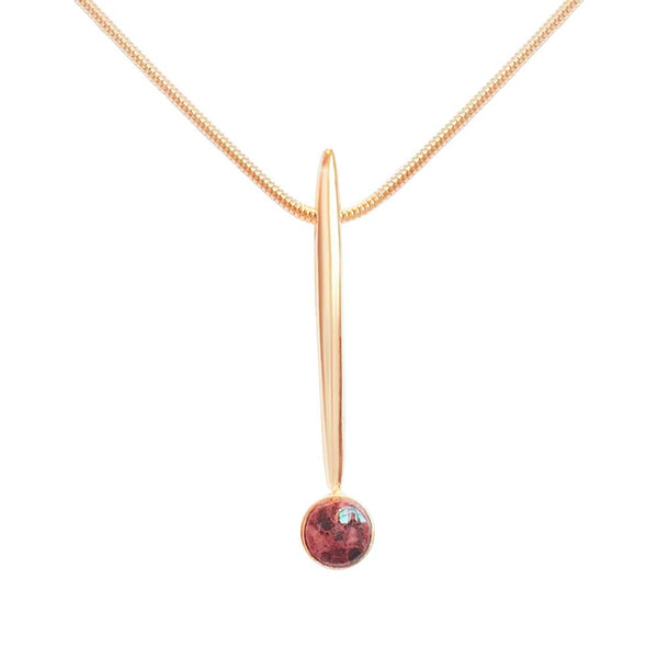 Rose gold bar pendant with a round red granite bead on a delicate chain