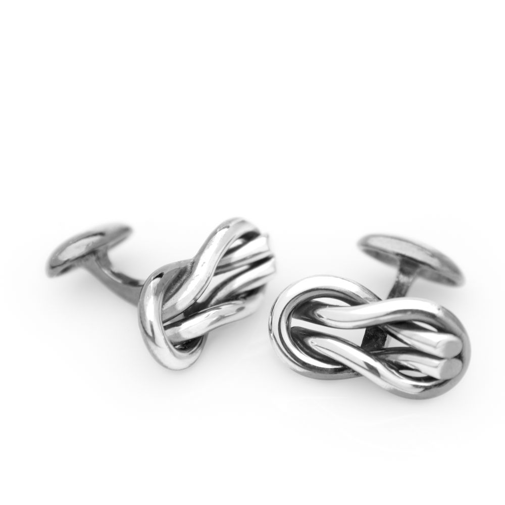 Pair of silver cufflinks with a knotted rope motif inspired by råbandsknop and nautical tradition.