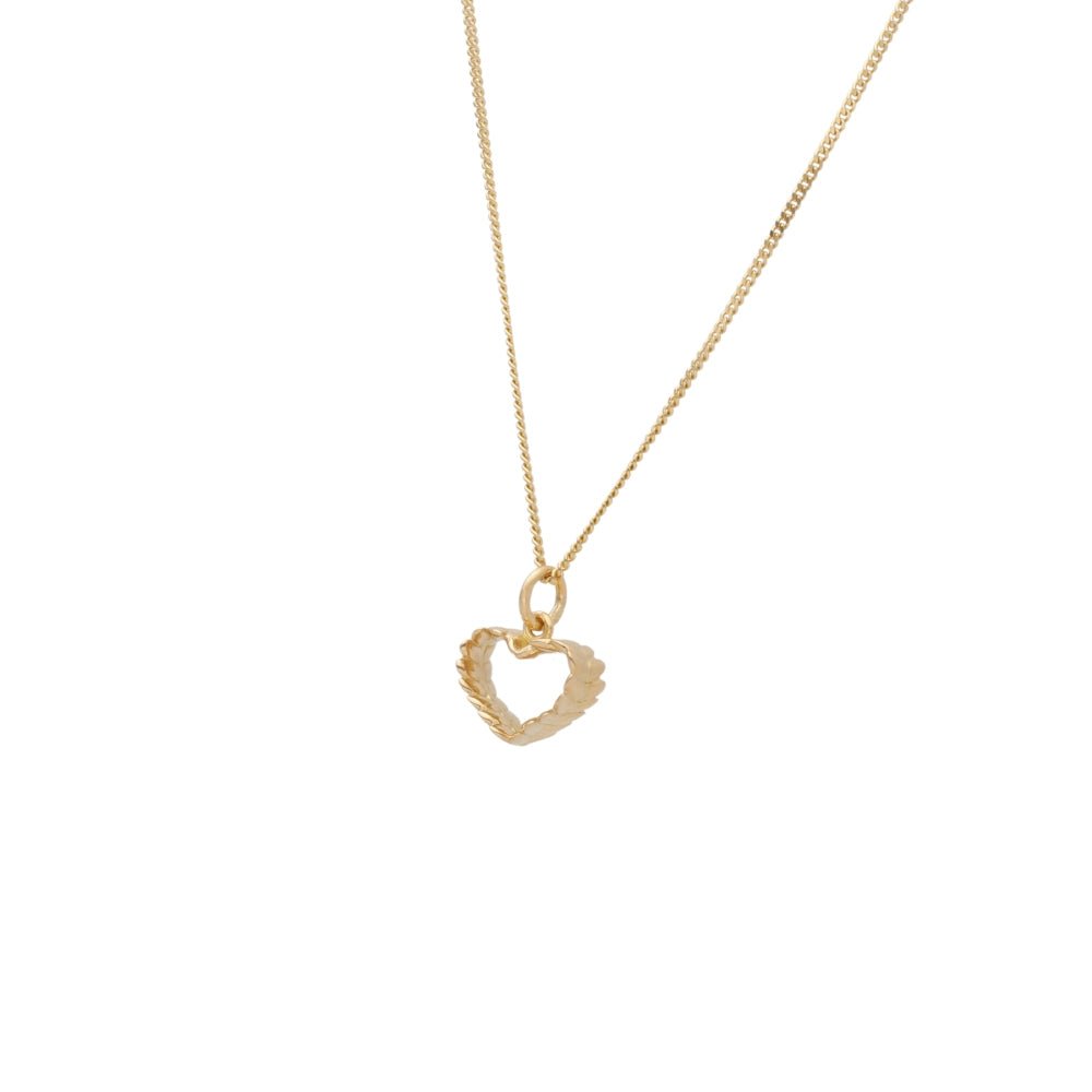 Delicate 18K gold chain necklace with an open heart pendant.