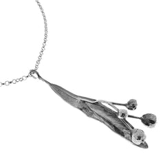 TILIA FRÖ necklace pendant in silver featuring a slender leaf and round seed pods