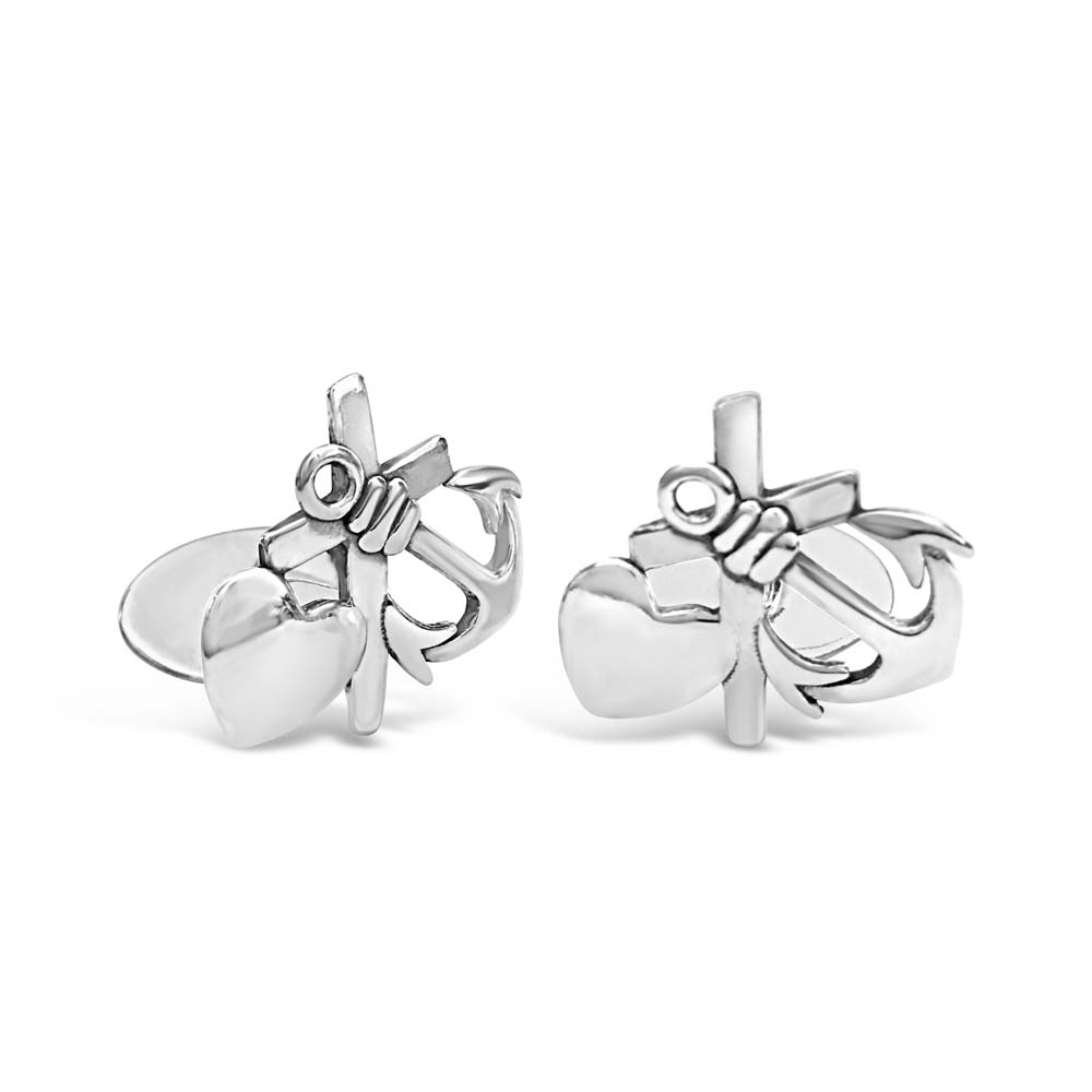 Pair of silver TRO HOPP & KÄRLEK cufflinks with heart and cross motif on a white background